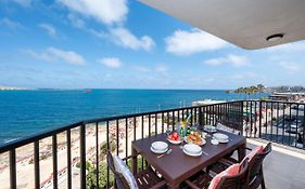 Islet Promenade Seafront Apartment With Large Corner Terrace By Getawaysmalta